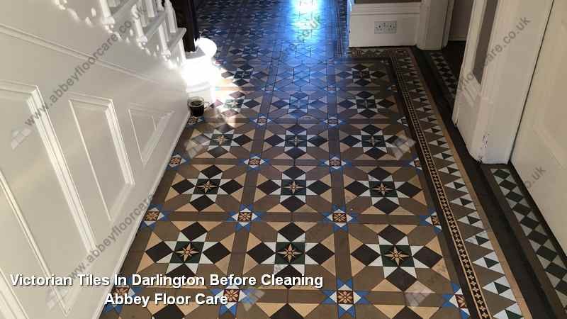 Sticky dark Victorian tile hallway in Darlington before controlled residue removal