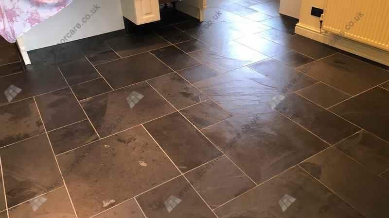 Restored slate floor after cleaning showing improved surface clarity